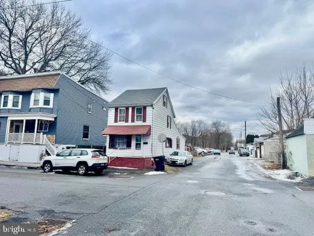 a view of a street with cars