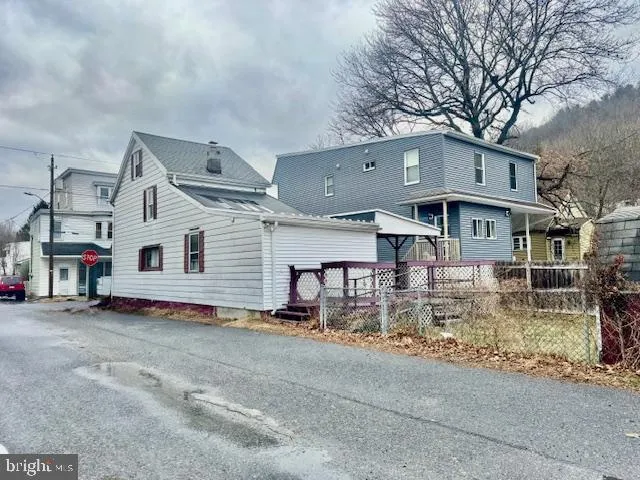 a view of a house with large windows