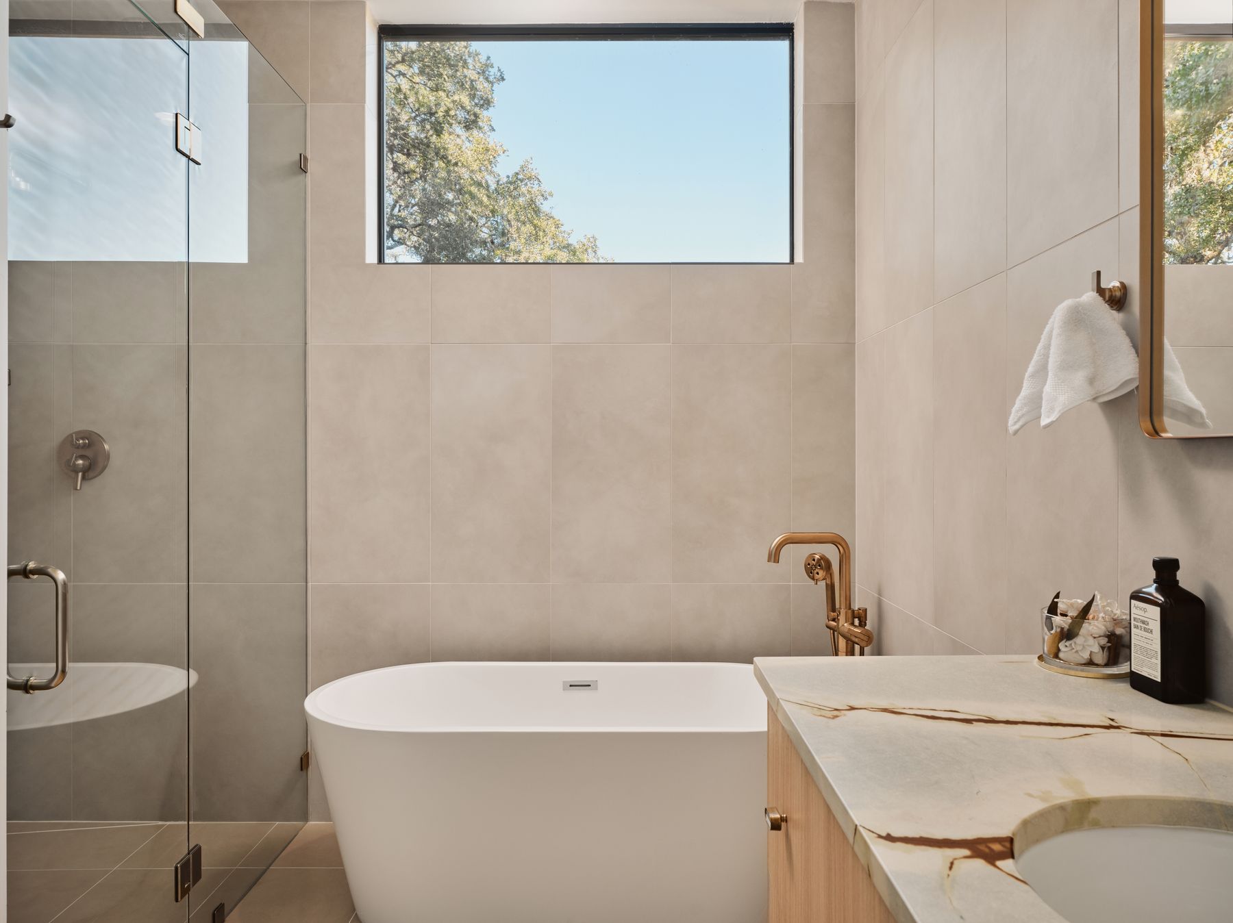 3209 Clawson Road Austin, TX 78704 - Photo 22 of 30 Bathroom featuring vanity, a stall shower, tile walls, and a freestanding bath