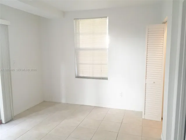 a view of a room that has a large window