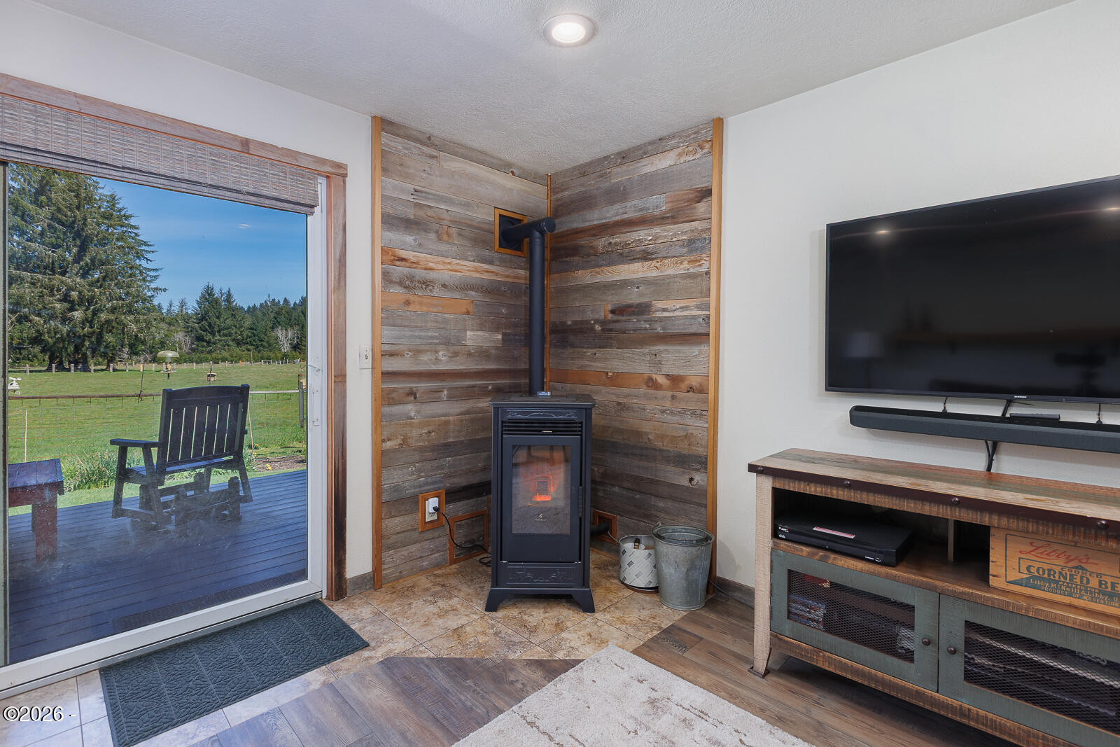 871 Old River Road Northeast Siletz, OR 97380 - Photo 26 of 86 Family room and Pellet Stove
