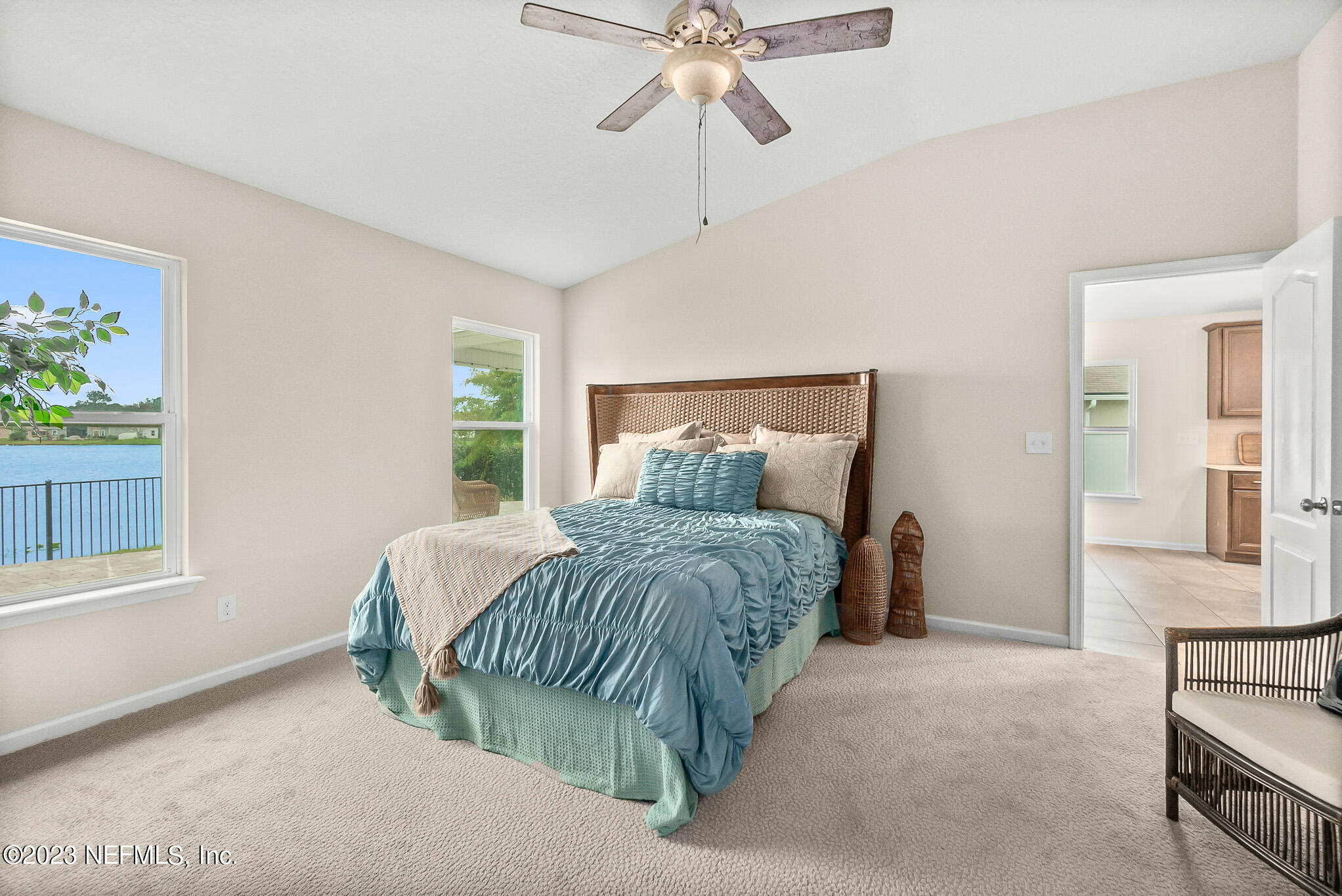 598 Deer Crossing Road St. Augustine, FL 32086 - Photo 15 of 33 a bedroom with a bed and window