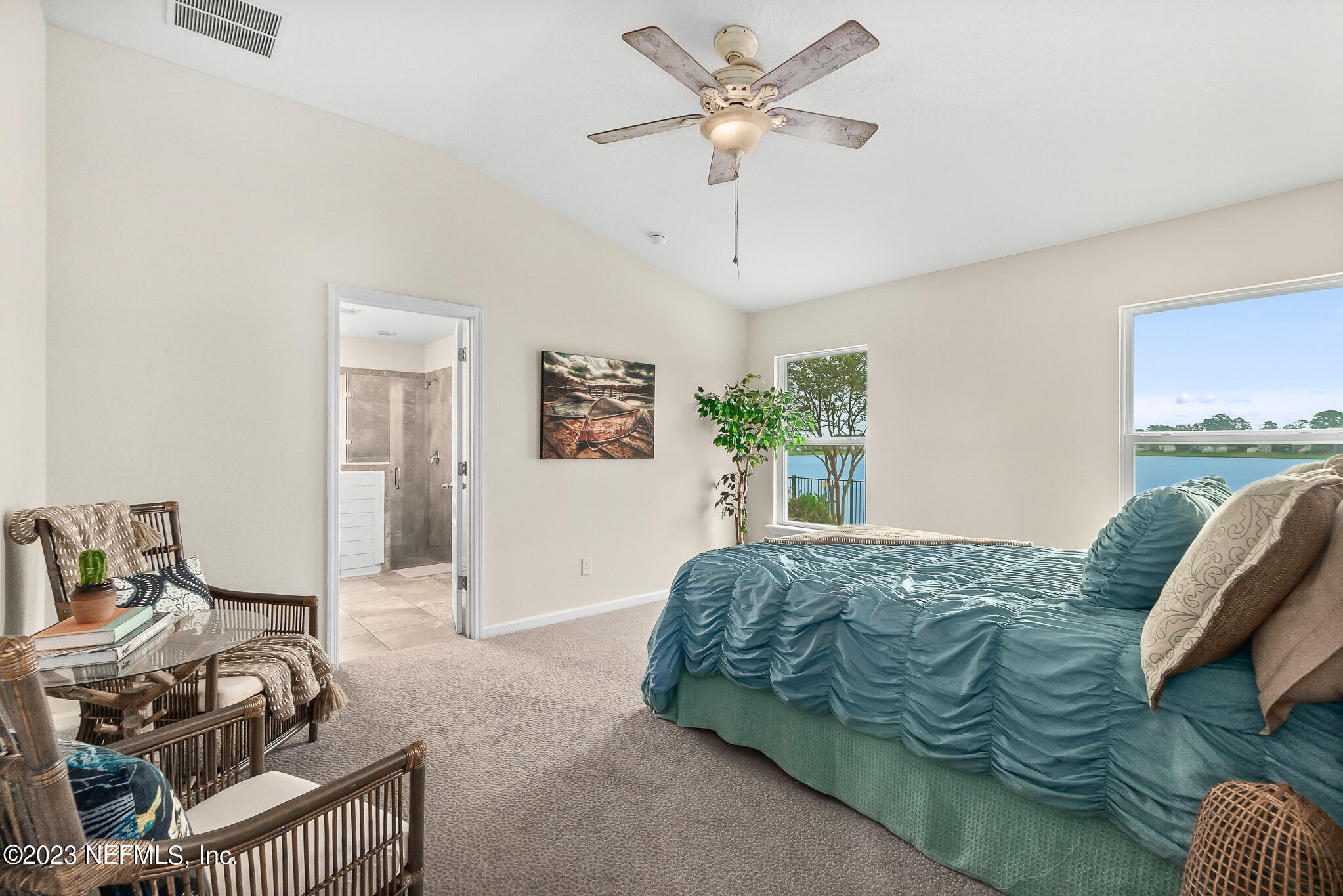 598 Deer Crossing Road St. Augustine, FL 32086 - Photo 16 of 33 a bedroom with furniture and a window