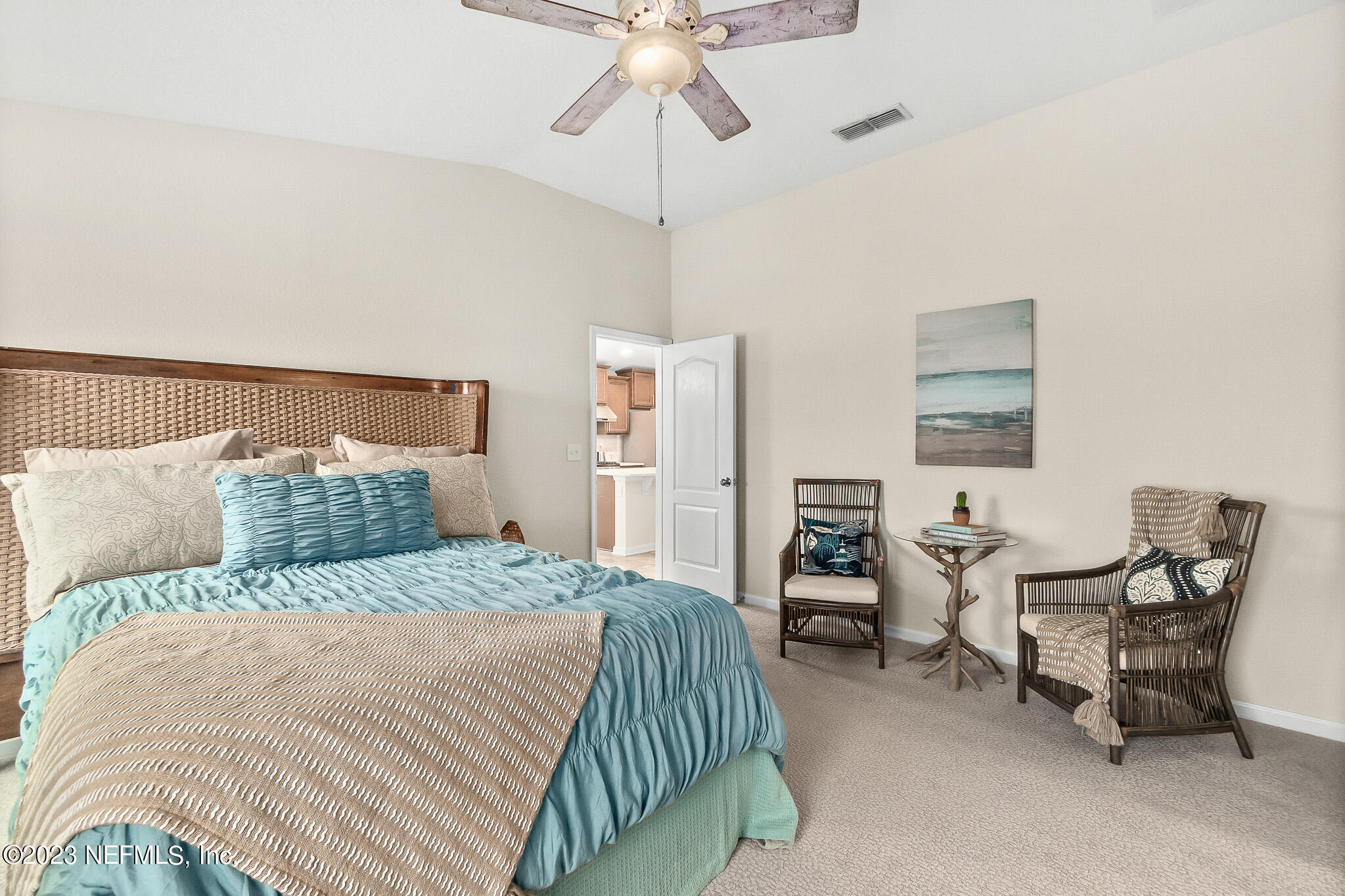 598 Deer Crossing Road St. Augustine, FL 32086 - Photo 17 of 33 a bedroom with a bed and furniture