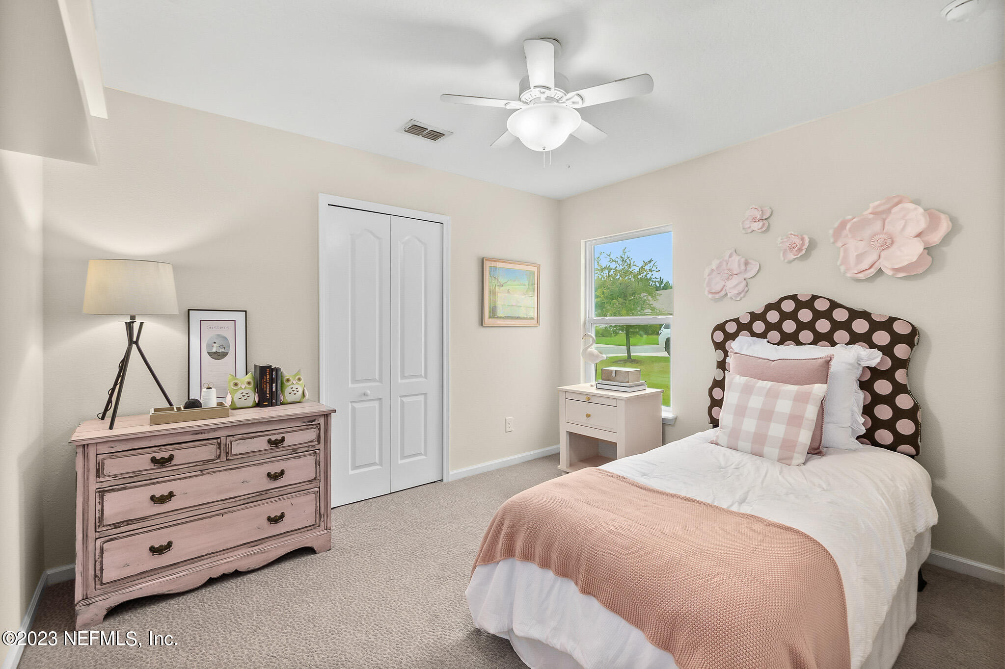 598 Deer Crossing Road St. Augustine, FL 32086 - Photo 26 of 33 a bedroom with a bed and a dresser