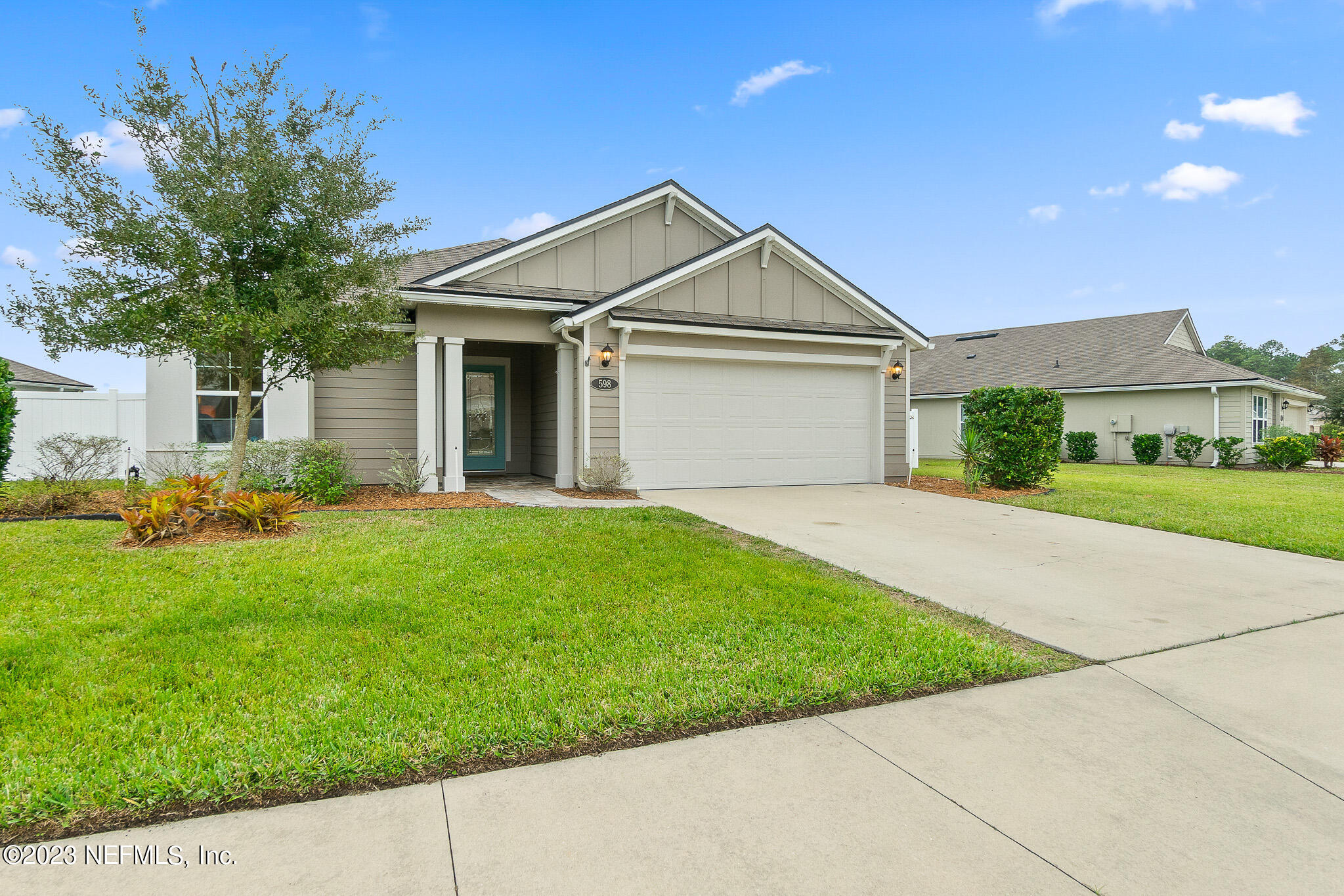 598 Deer Crossing Road St. Augustine, FL 32086 - Photo 30 of 33 a front view of house with yard and green space