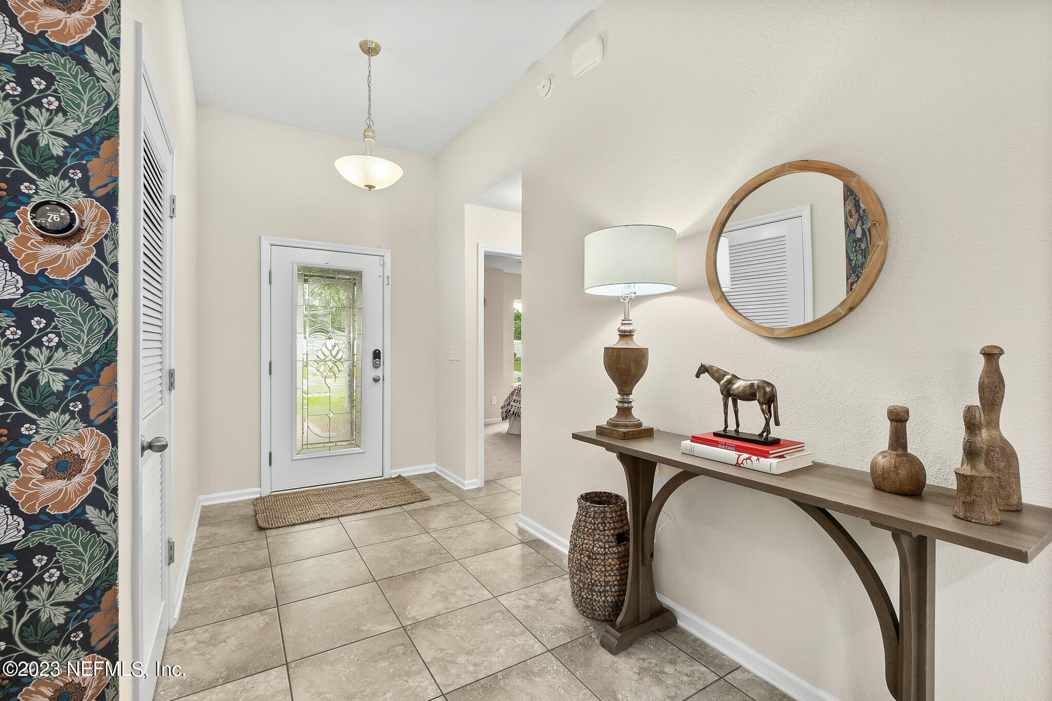 598 Deer Crossing Road St. Augustine, FL 32086 - Photo 5 of 33 a bathroom with a sink and a mirror