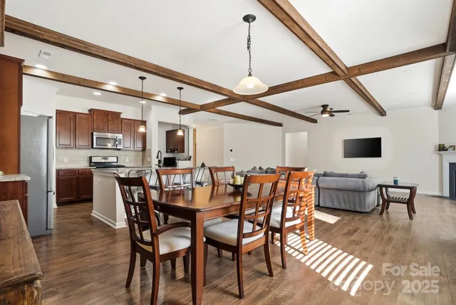 a dining room with furniture and window
