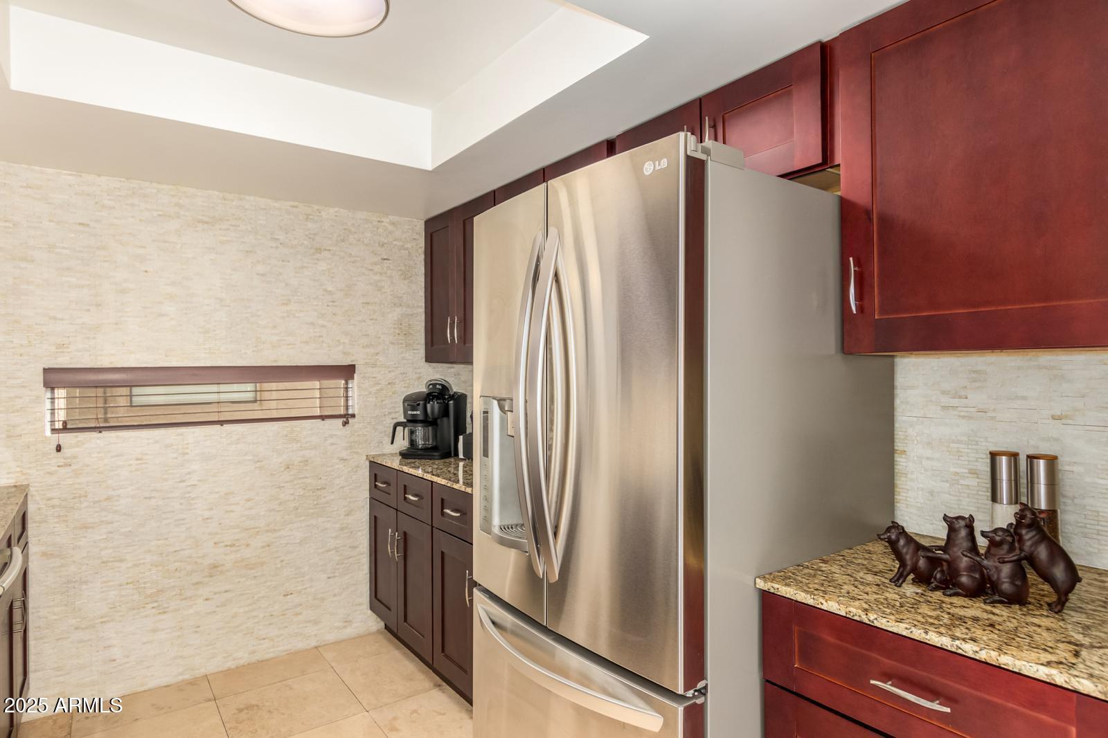 10015 East Mountain View Road, Unit 2017 Scottsdale, AZ 85258 - Photo 22 of 45 a kitchen with metallic refrigerator and stove
