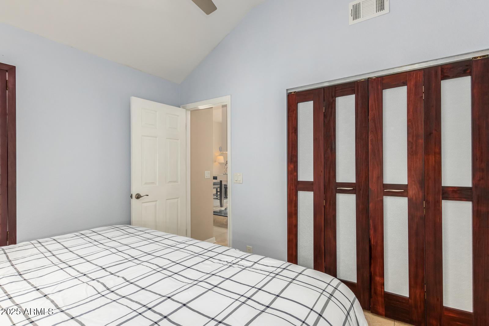 10015 East Mountain View Road, Unit 2017 Scottsdale, AZ 85258 - Photo 28 of 45 a bedroom with a bed and a window