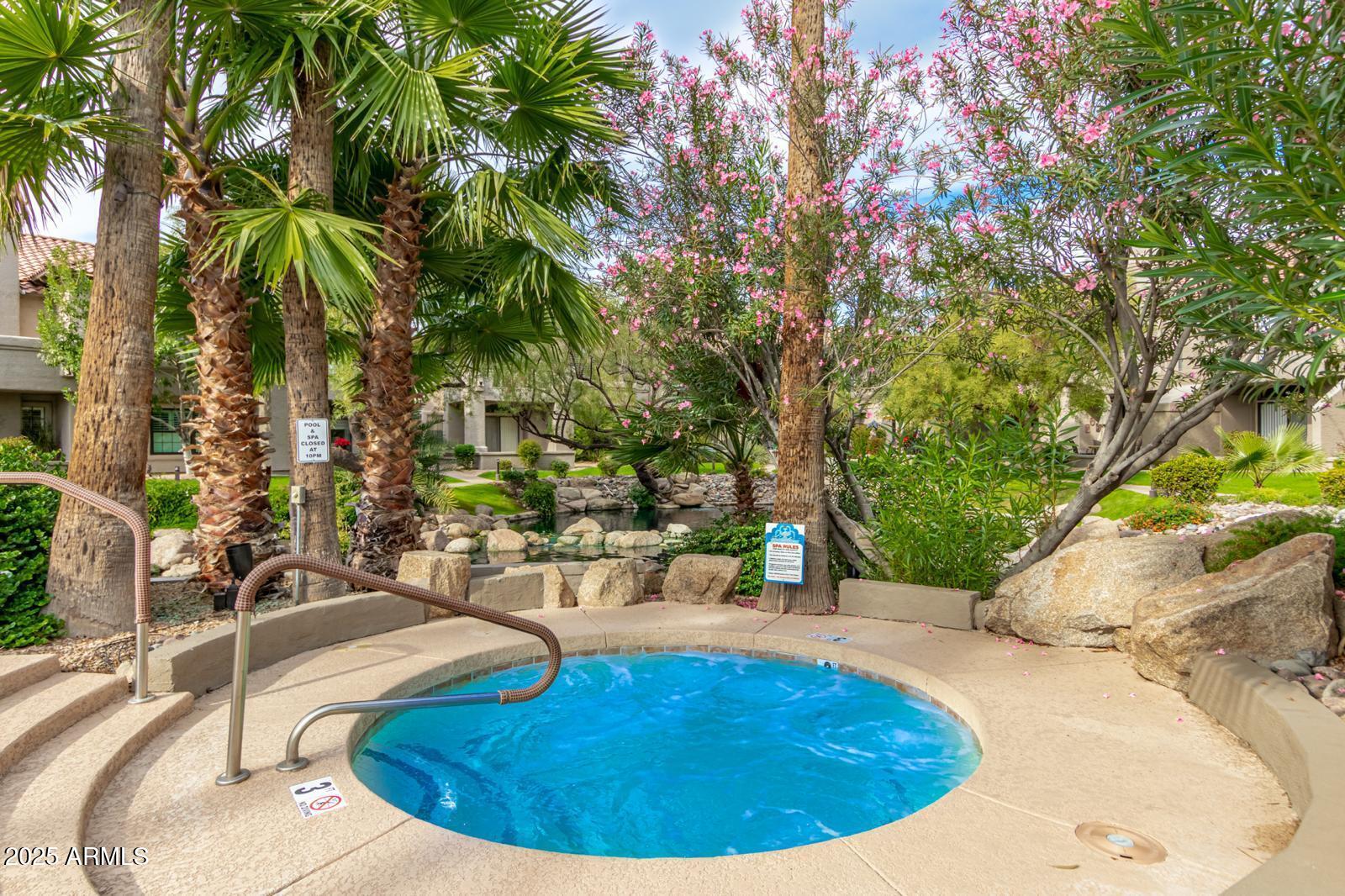 10015 East Mountain View Road, Unit 2017 Scottsdale, AZ 85258 - Photo 41 of 45 a view of a swimming pool with an outdoor seating