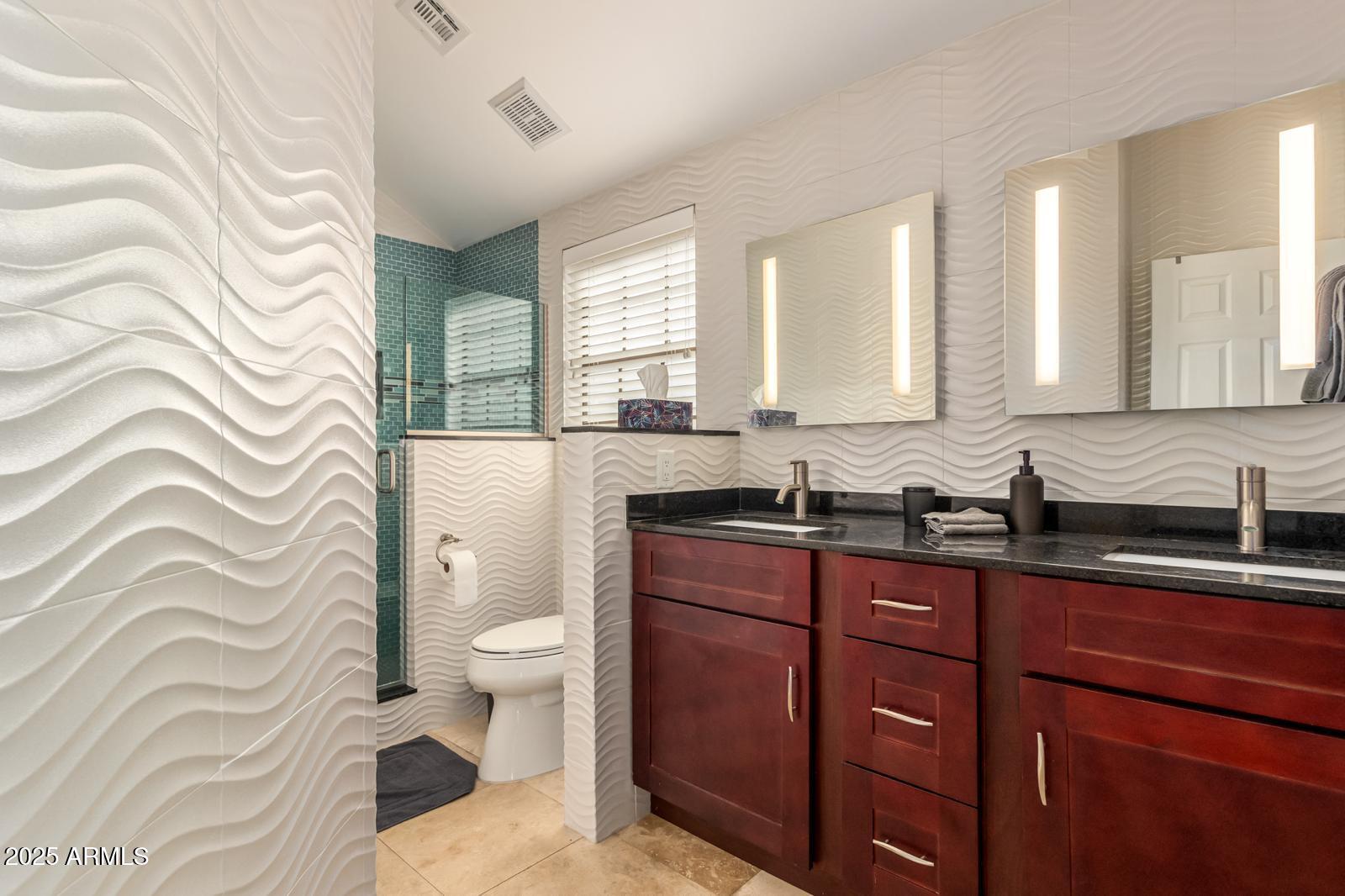 10015 East Mountain View Road, Unit 2017 Scottsdale, AZ 85258 - Photo 6 of 45 a spacious bathroom with a sink a toilet and a mirror