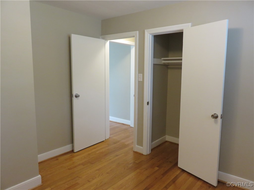 8708 Mapleton Road Henrico, VA 23229 - Photo 13 of 28 a view of an empty room with wooden floor
