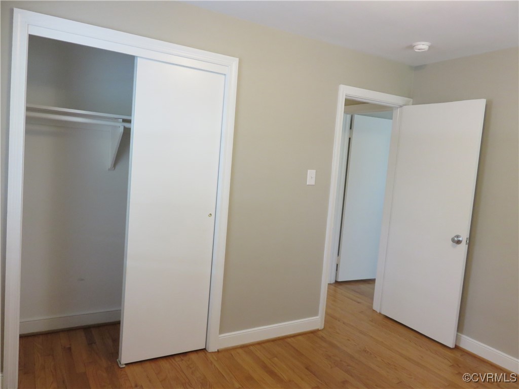 8708 Mapleton Road Henrico, VA 23229 - Photo 15 of 28 a view of an empty room with wooden floor