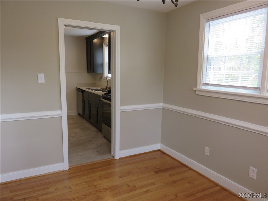 8708 Mapleton Road Henrico, VA 23229 - Photo 6 of 28 an empty room with wooden floor and entrance