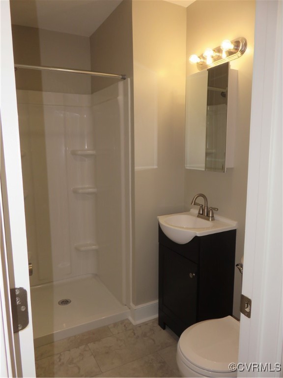 8708 Mapleton Road Henrico, VA 23229 - Photo 10 of 28 a bathroom with a sink a toilet and shower