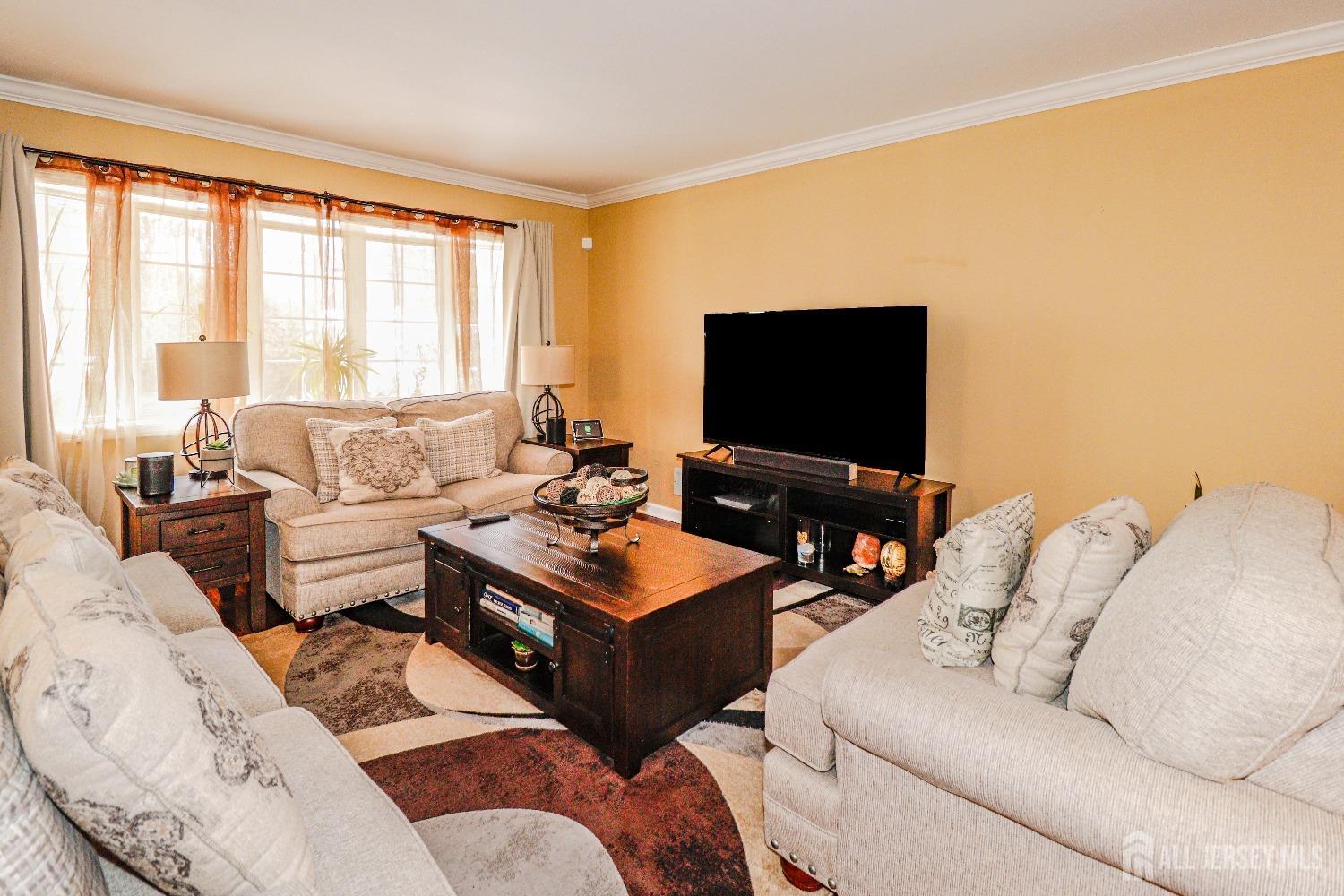 161 Devon Road Colonia, NJ 07067 - Photo 12 of 34 a living room with furniture and a flat screen tv
