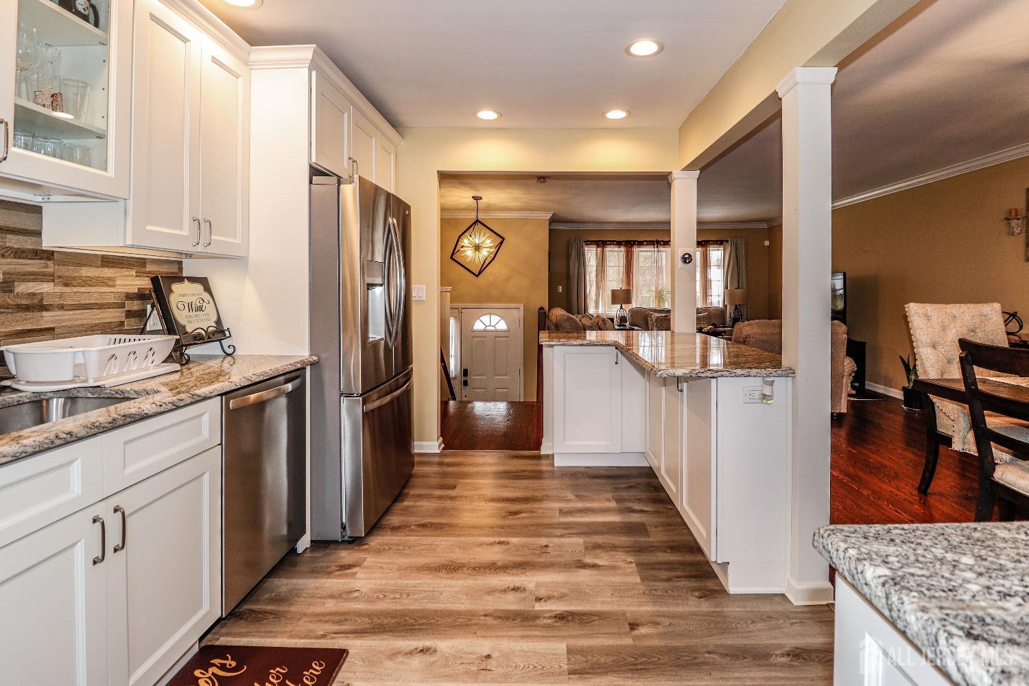 161 Devon Road Colonia, NJ 07067 - Photo 16 of 34 a kitchen with stainless steel appliances granite countertop a refrigerator and stove