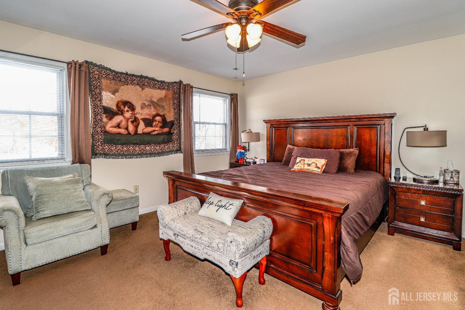 161 Devon Road Colonia, NJ 07067 - Photo 20 of 34 a bedroom with a bed couch and window