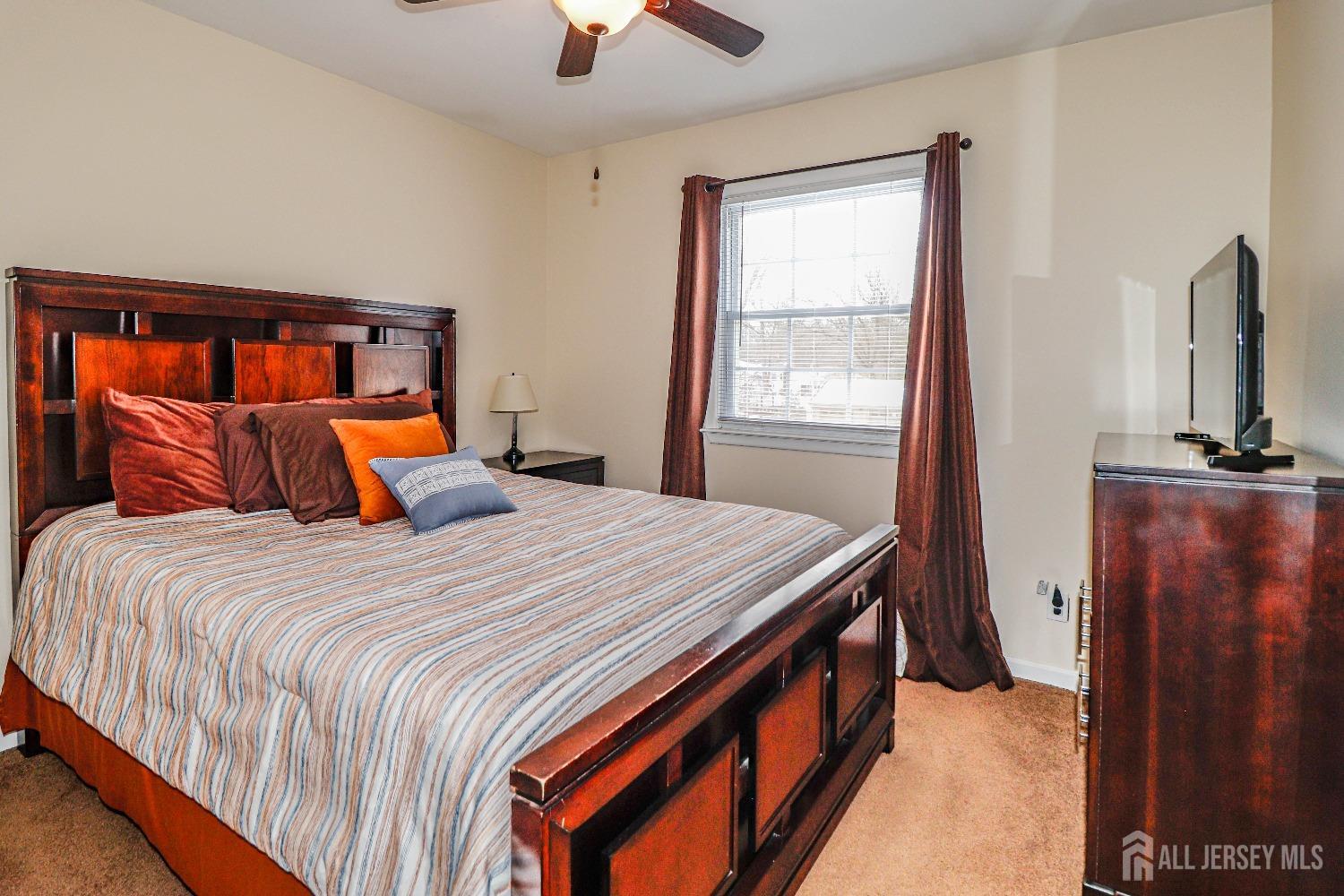 161 Devon Road Colonia, NJ 07067 - Photo 25 of 34 a bedroom with a bed and a window