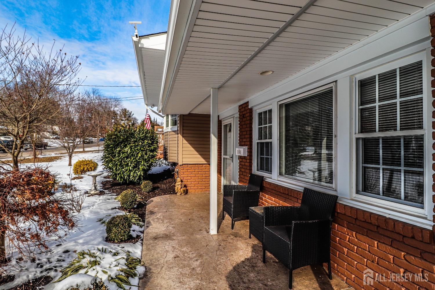 161 Devon Road Colonia, NJ 07067 - Photo 4 of 34 a view of a porch with chairs and potted plants