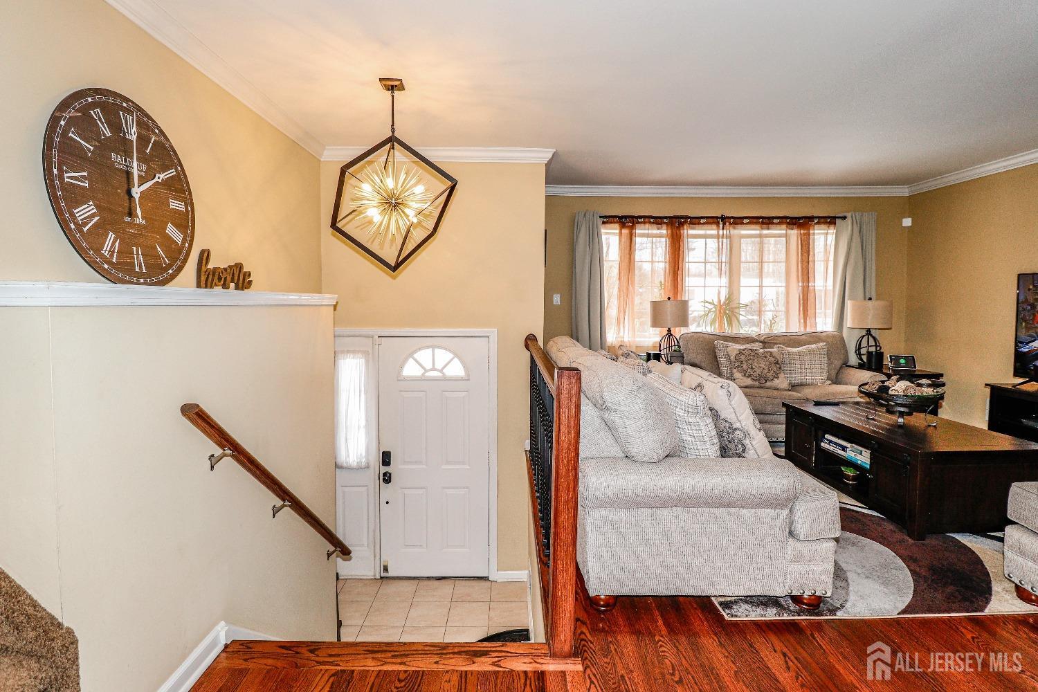 161 Devon Road Colonia, NJ 07067 - Photo 6 of 34 a living room with furniture and a wooden floor
