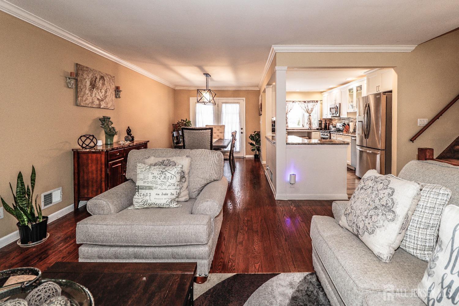 161 Devon Road Colonia, NJ 07067 - Photo 7 of 34 a living room with furniture and a large window