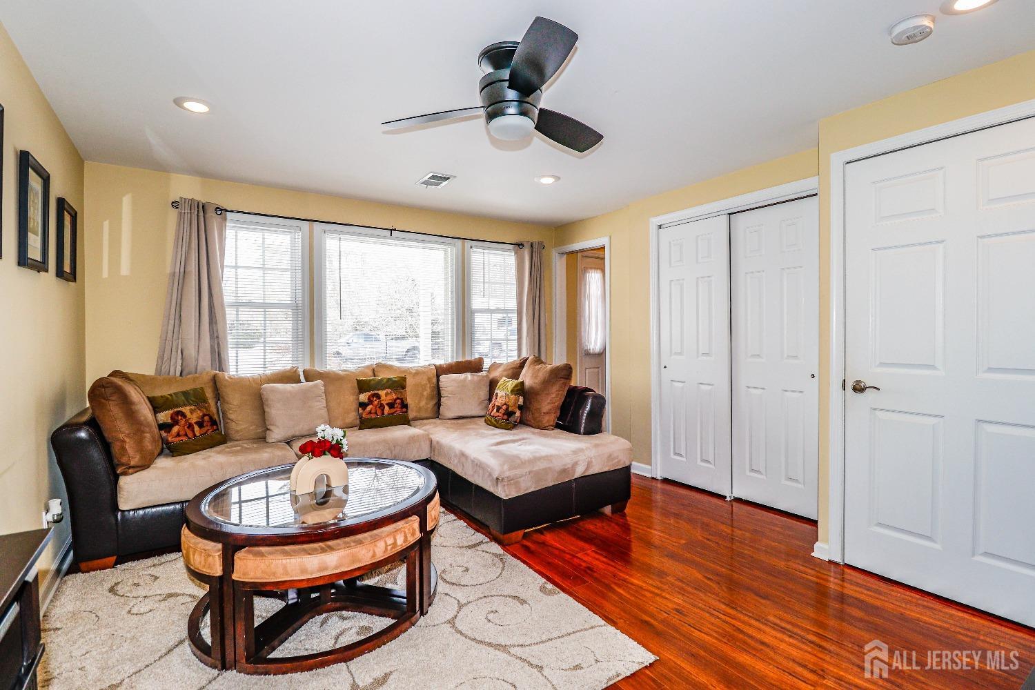 161 Devon Road Colonia, NJ 07067 - Photo 9 of 34 a living room with furniture and a large window