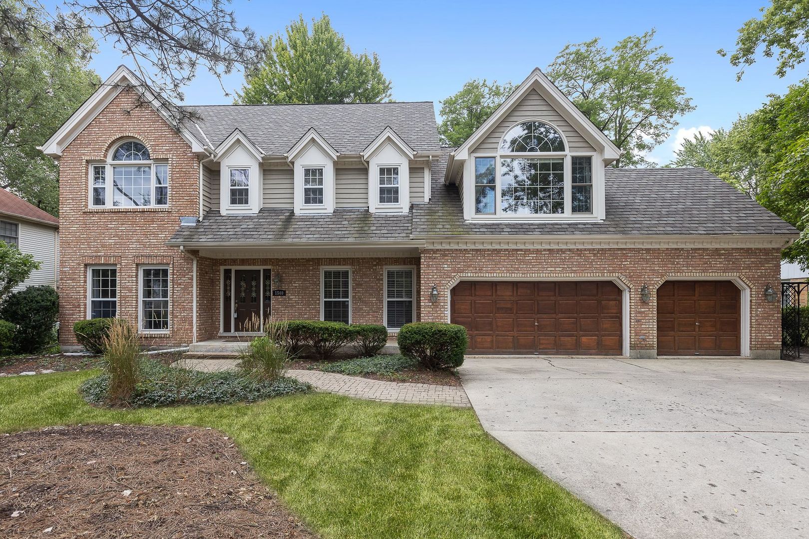 1540 West Wiesbrook Road Wheaton, IL 60189 - Photo 2 of 36 a view of a yard in front of a house