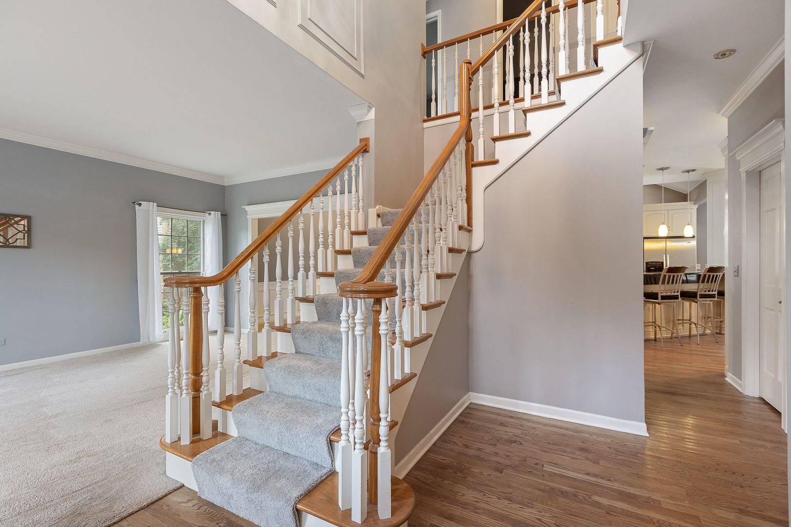 1540 West Wiesbrook Road Wheaton, IL 60189 - Photo 17 of 36 a view of staircase with wooden floor and a rug