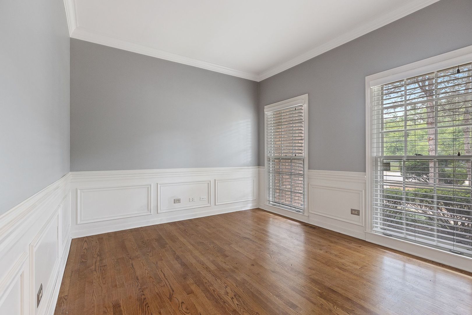 1540 West Wiesbrook Road Wheaton, IL 60189 - Photo 19 of 36 wooden floor in an empty room with a window