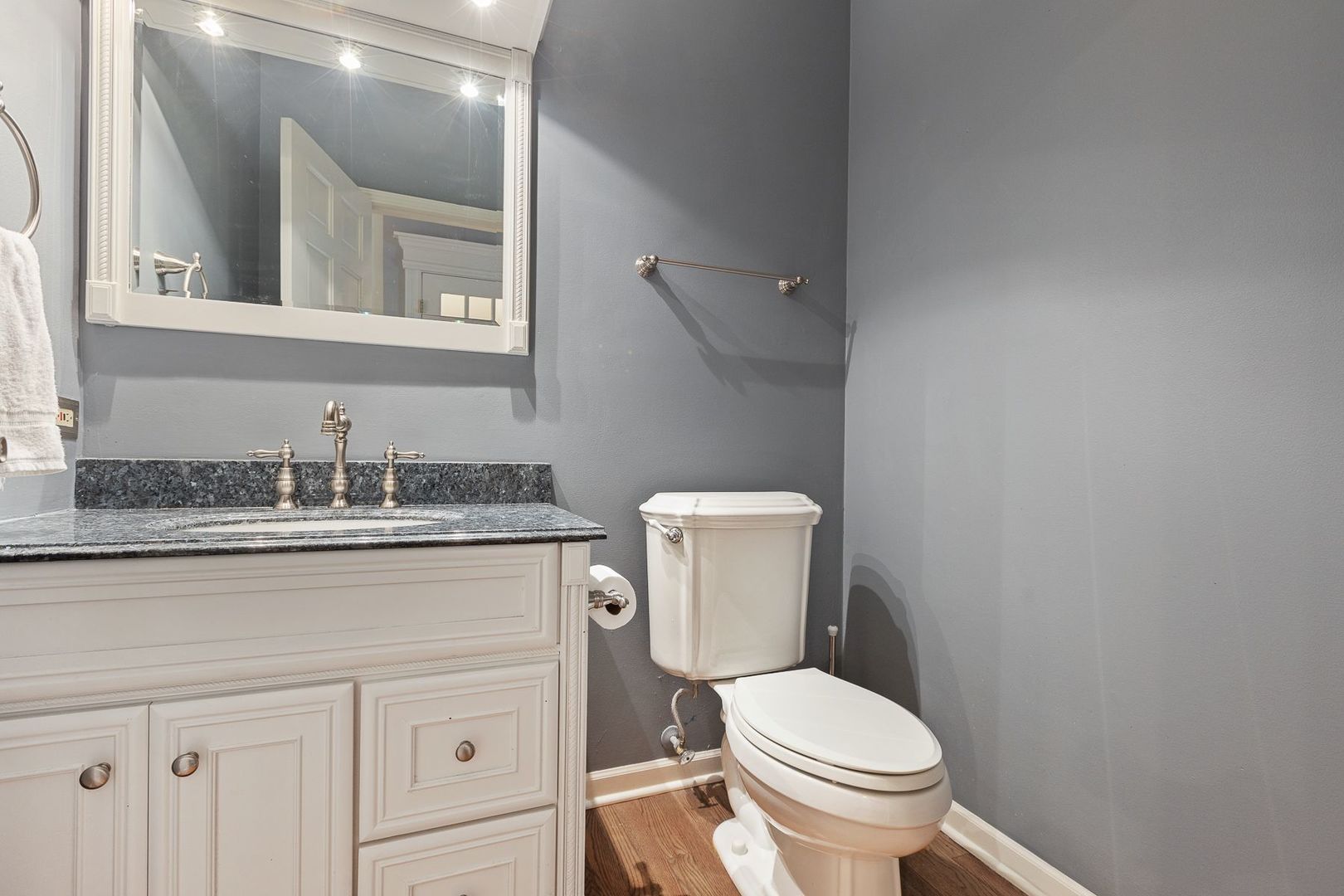 1540 West Wiesbrook Road Wheaton, IL 60189 - Photo 20 of 36 a bathroom with a granite countertop toilet and a sink
