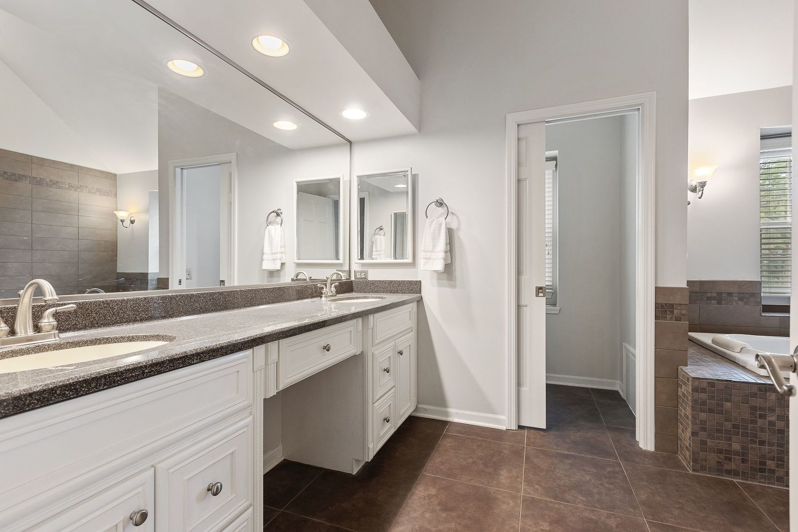 1540 West Wiesbrook Road Wheaton, IL 60189 - Photo 23 of 36 a spacious bathroom with a double vanity sink a mirror and a shower