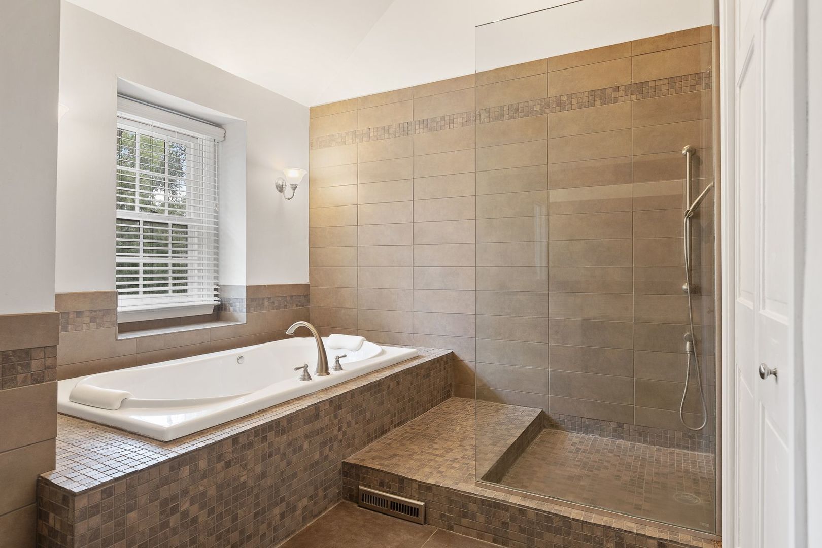 1540 West Wiesbrook Road Wheaton, IL 60189 - Photo 24 of 36 a bathroom with a tub a sink and a window