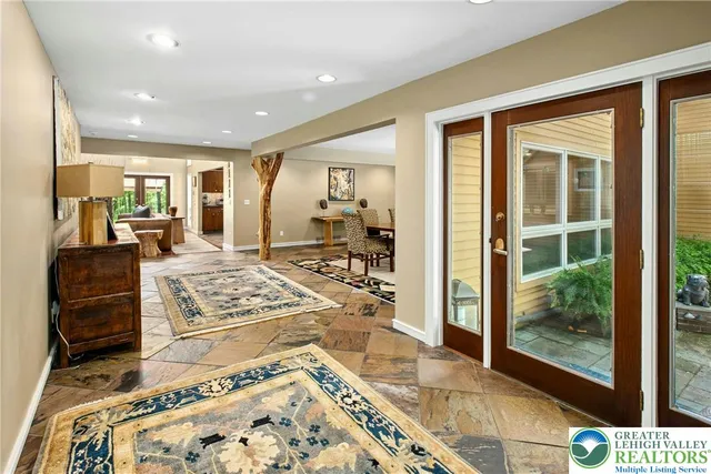 a kitchen with stainless steel appliances granite countertop a sink and a stove