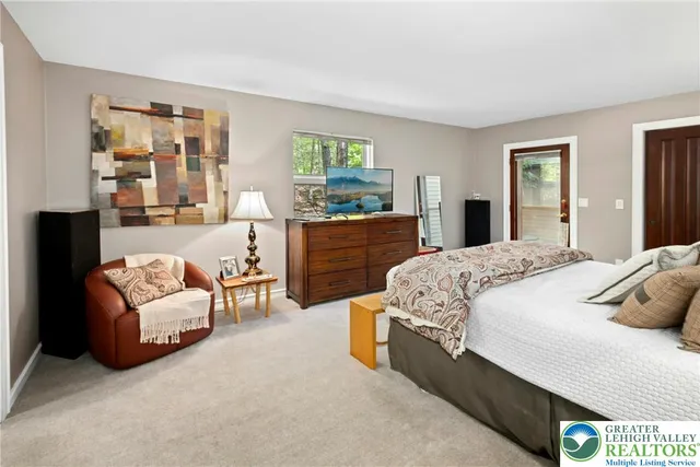 a bed room with a bed and a large window