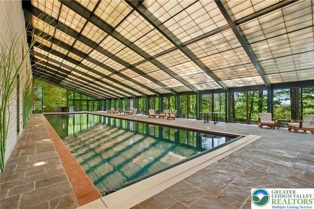 a view of swimming pool with a patio