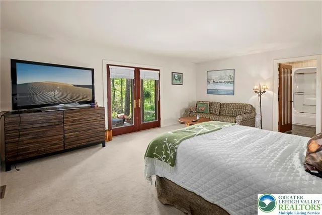 a balcony with furniture and a potted plant