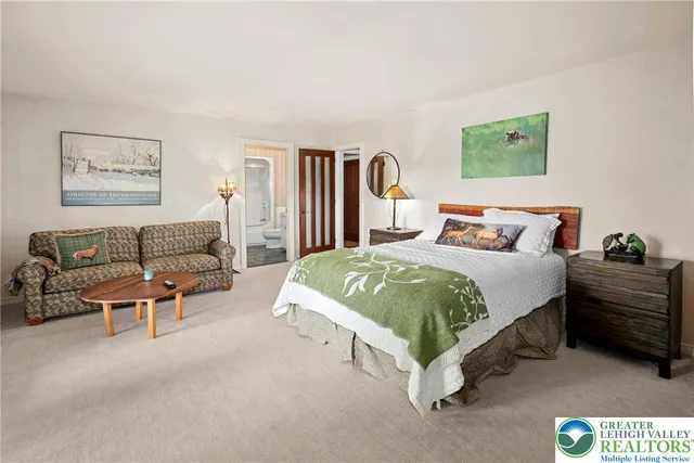 a view of a patio with lawn chairs and wooden floor