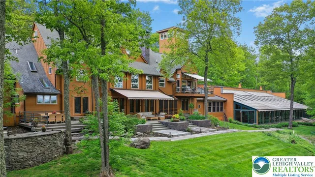 a view of a patio with table and chairs and wooden floor