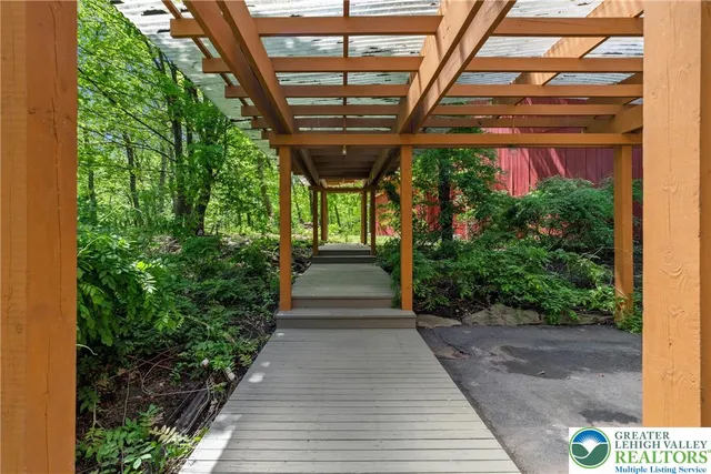 a living room with furniture and a table with wooden floor