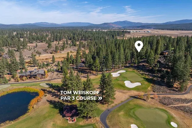 an aerial view of a house with a swimming pool yard and outdoor seating