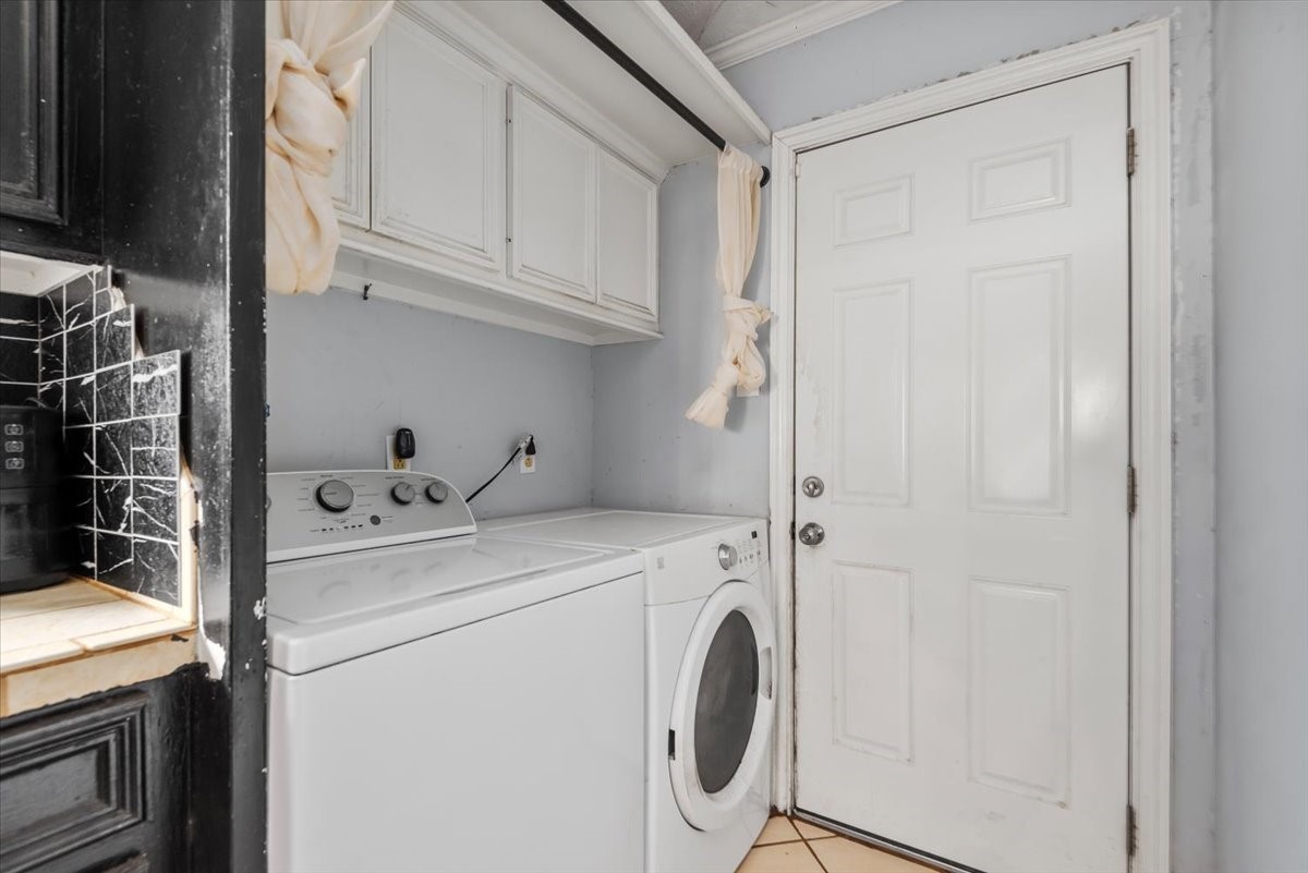 23011 Bayleaf Drive Spring, TX 77373 - Photo 14 of 22 a utility room with dryer and washer