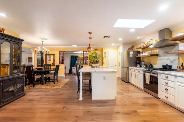 a bathroom with a double vanity sink mirror and toilet