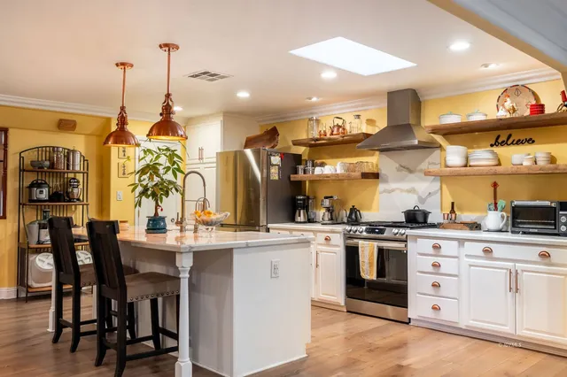 a bedroom with furniture and a window