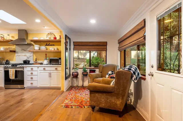 a bedroom with a bed and a lamp with the dresser