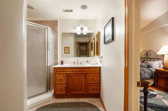 a bed room with a bed and a television