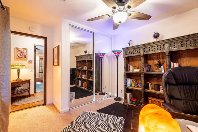 a view of a patio with table and chairs and potted plants