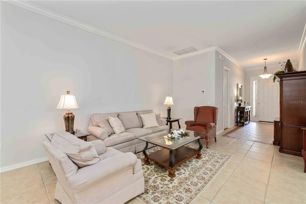 8150 Indigo Ridge Terrace University Park, FL 34201 - Photo 16 of 56 a living room with furniture fireplace and a lamp