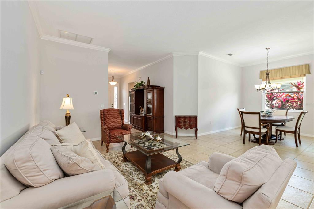 8150 Indigo Ridge Terrace University Park, FL 34201 - Photo 17 of 56 a living room with furniture and wooden floor